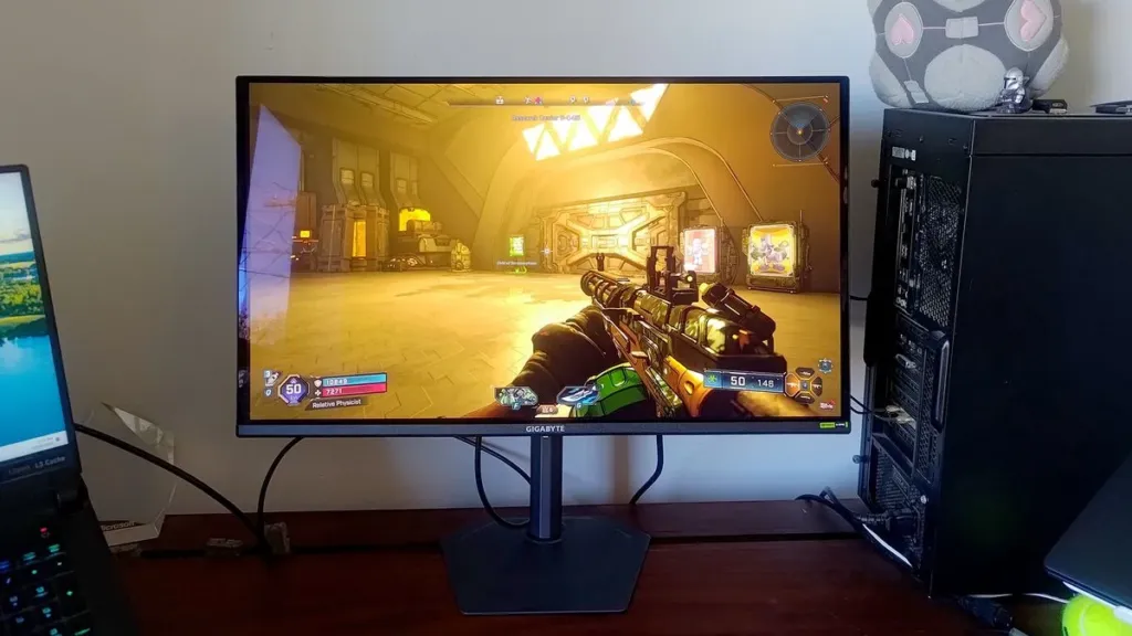 Gigabyte GO27Q24A screen reflecting the room around it during a dark scene